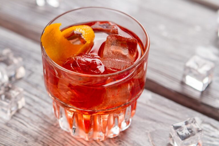Glass with dark orange drink